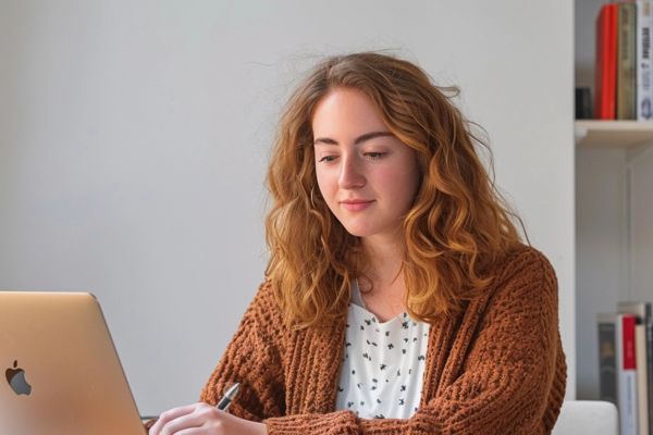 student proofreading her dissertation with Oxbridge Essay's help