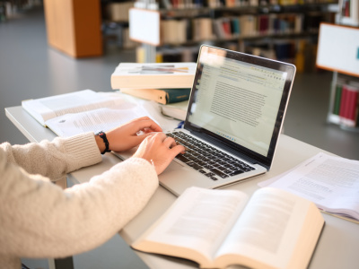 student working on a dissertation chapter