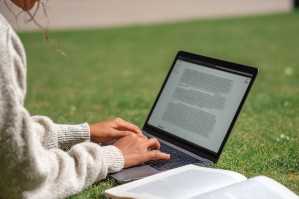student working on a dissertation